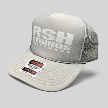 Raree Finds gray RSH Studios Hollywood trucker hat with white tonal print, mesh back, and braided rope brim detail.