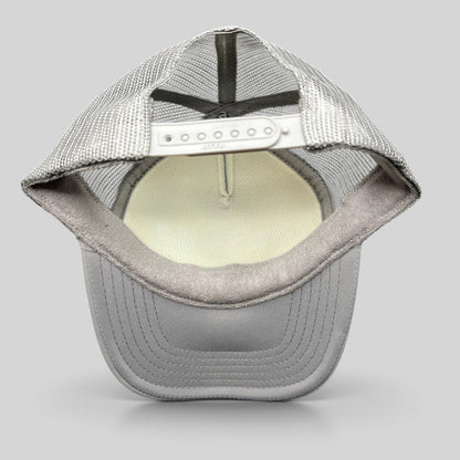 Raree Finds gray OTTO trucker hat interior view showing mesh backing, foam crown, and adjustable snapback closure