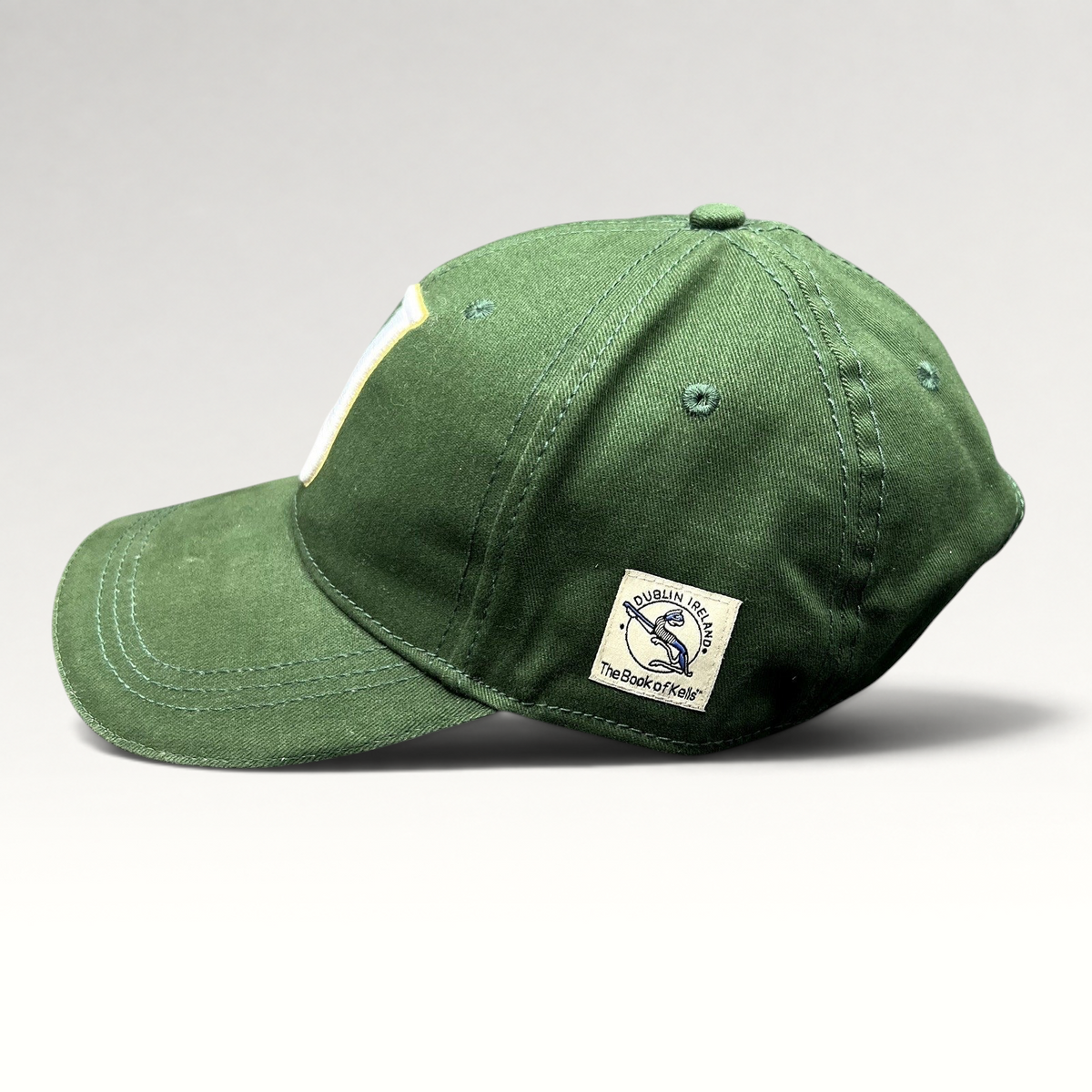 Raree Finds dark green Book of Kells strapback hat with side patch featuring Dublin Ireland Celtic knot embroidery