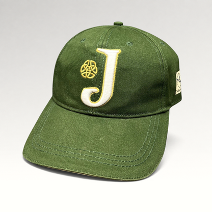 Raree Finds dark green strapback hat featuring an embroidered white J logo and gold Celtic knot detail.