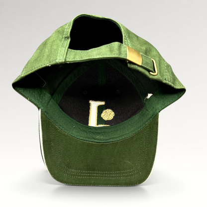 Raree Finds dark green strapback hat with gold Celtic knot embroidery and brass buckle adjuster, interior view.