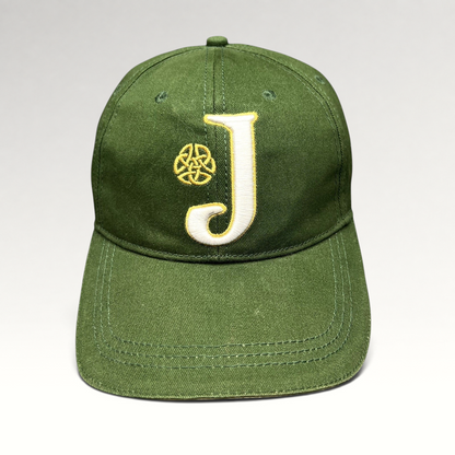 Raree Finds dark green strapback hat with an embroidered white J logo and gold Celtic knot symbol on the front.