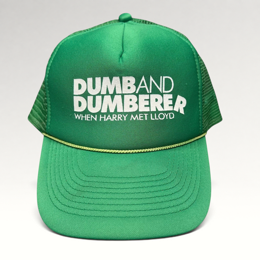 Raree Finds vintage green foam trucker hat with Dumb and Dumberer movie promo print, mesh back, and rope brim detail.