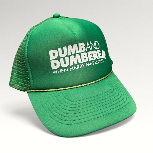 Raree Finds vintage green foam trucker hat with white Dumb and Dumberer movie logo and yellow brim rope detail
