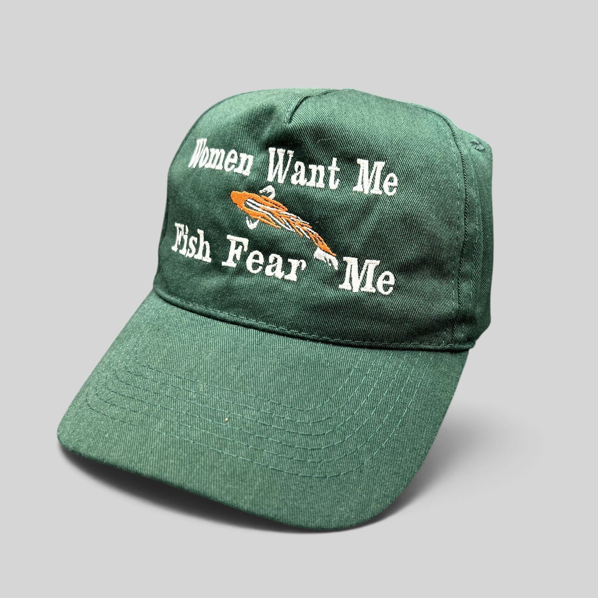 Raree Finds forest green dad cap with Women Want Me Fish Fear Me embroidery and an orange fishing lure graphic