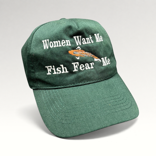 Raree Finds forest green dad cap with embroidered Women Want Me Fish Fear Me slogan and orange fishing lure graphic.