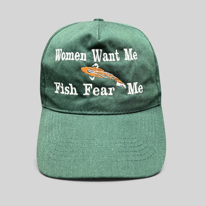 Raree Finds forest green dad cap with Women Want Me Fish Fear Me embroidery and an orange fishing lure graphic.