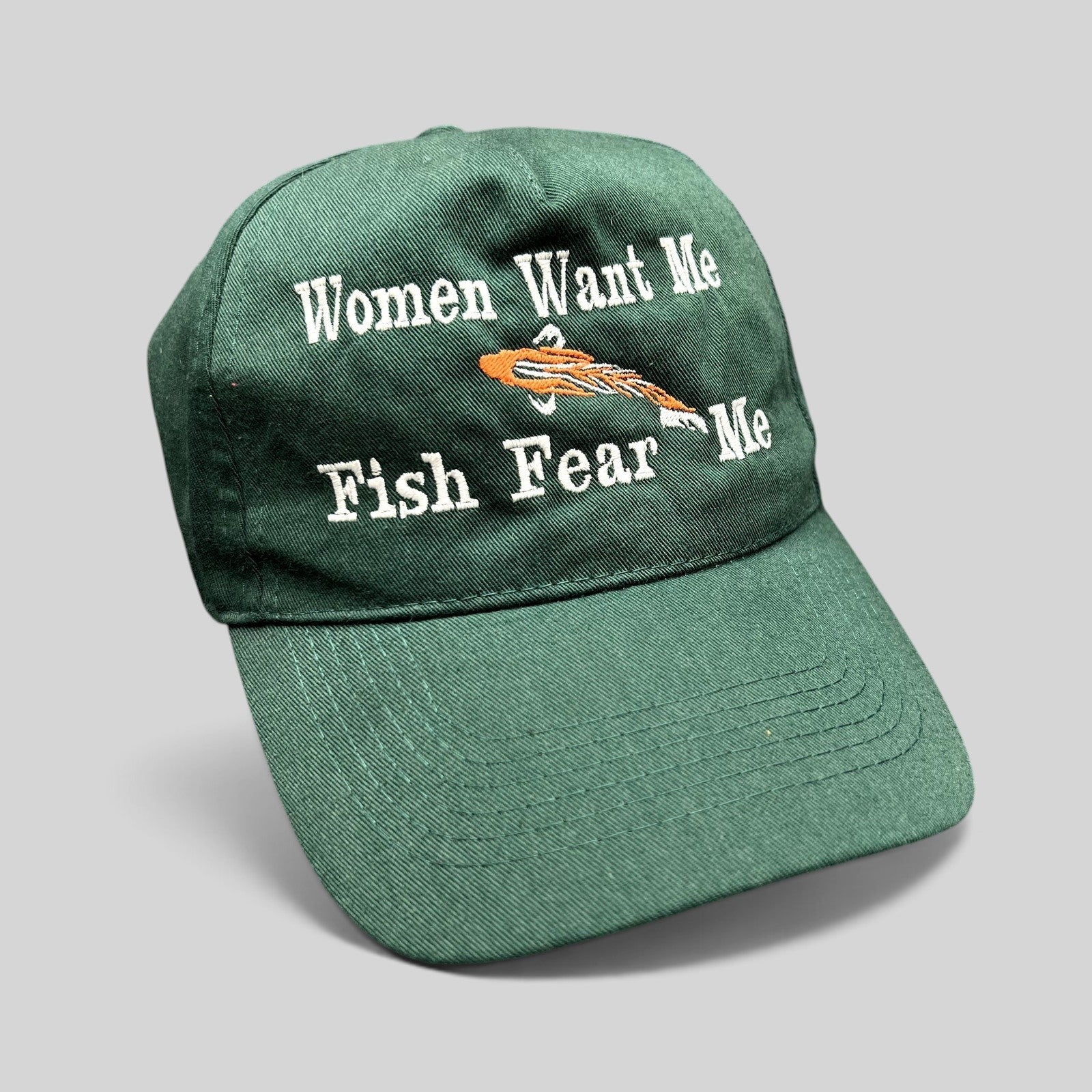 Raree Finds forest green dad cap with white embroidered Women Want Me Fish Fear Me slogan and orange fishing lure