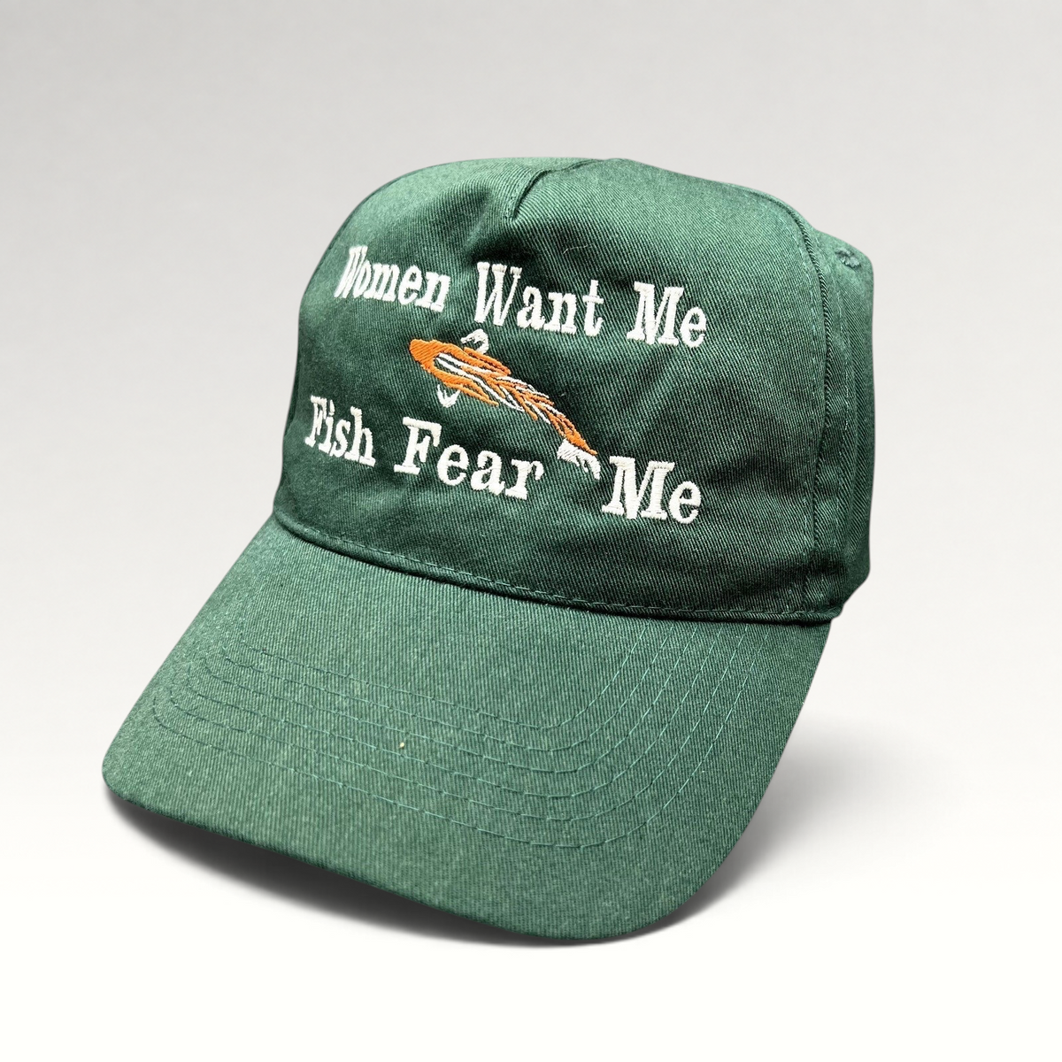 Raree Finds forest green dad cap with Women Want Me Fish Fear Me embroidery and orange fishing lure graphic