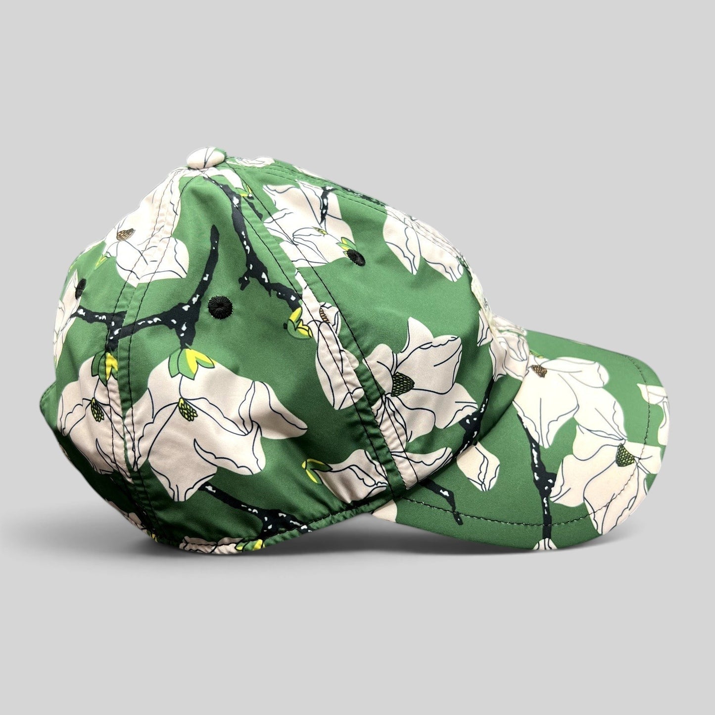 Raree Finds Rag & Bone New York green magnolia floral print strapback cap with a curved brim and lightweight fabric.