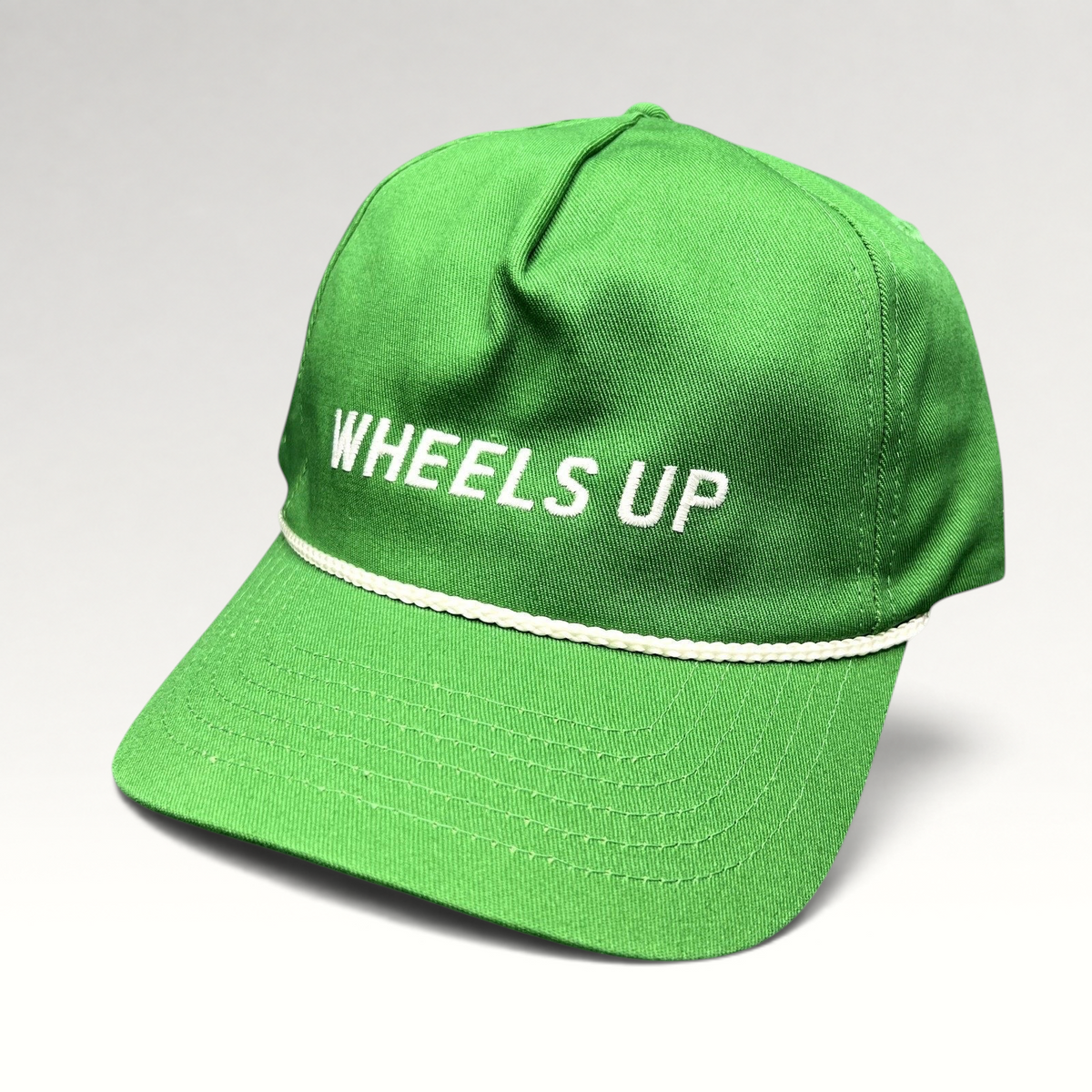 Raree Finds green cotton strapback hat with white Wheels Up embroidery and a classic white rope detail on the brim.