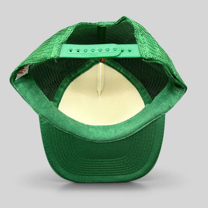 Raree Finds green and white OTTO Collection trucker snapback hat showing the adjustable plastic strap and mesh back