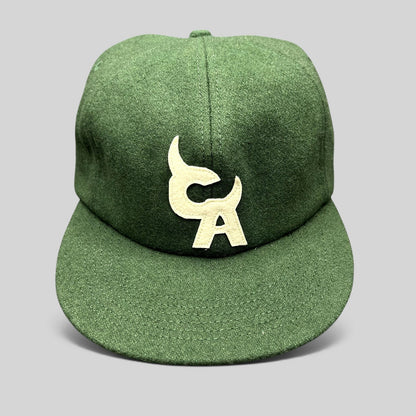 Raree Finds forest green wool-style strapback hat with cream embroidered Chromakopia logo and flat bill design.