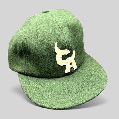 Raree Finds forest green wool-style strapback hat with cream embroidered Chromakopia logo and flat bill design.