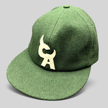 Raree Finds forest green wool-style strapback hat with a large cream embroidered logo on the front