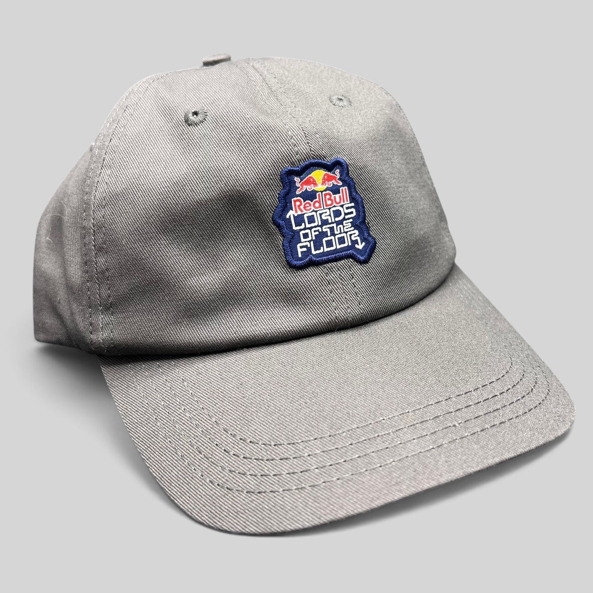 Raree Finds grey cotton snapback hat featuring an embroidered Red Bull Lords of the Floor event patch