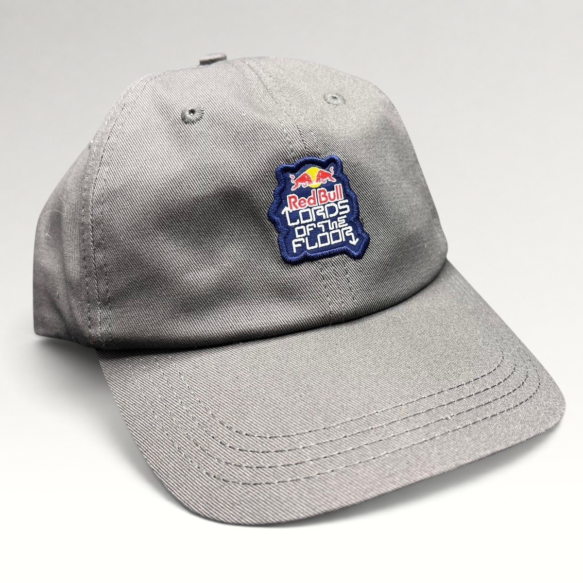 Raree Finds grey cotton snapback hat featuring an embroidered Red Bull Lords of the Floor event patch