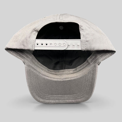 Raree Finds grey cotton twill snapback hat showing the adjustable plastic closure and interior construction