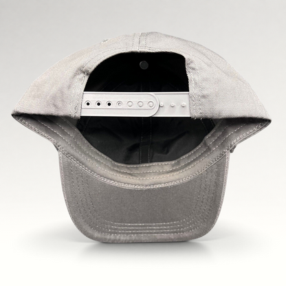 Raree Finds grey cotton twill snapback hat showing the adjustable plastic closure and interior construction