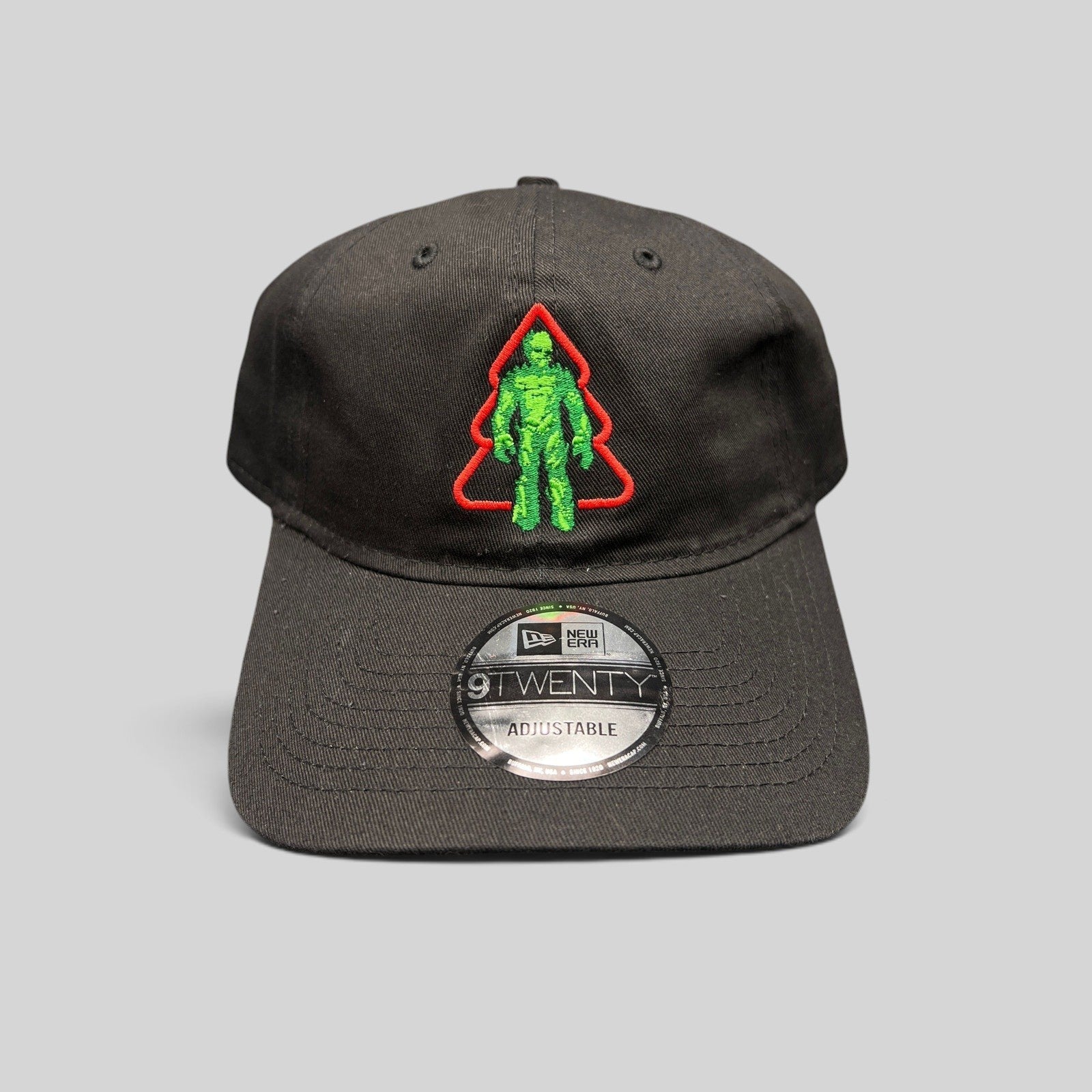 Raree Finds black New Era 9TWENTY cotton hat featuring an embroidered green Groot in a red Christmas tree outline.
