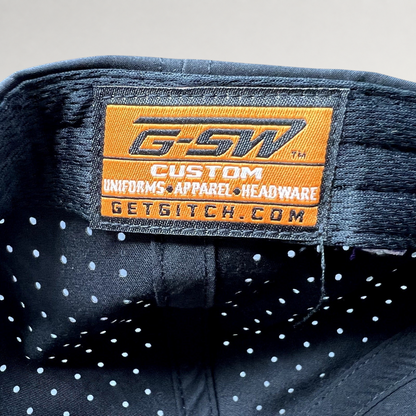 Raree Finds GSW Custom Apparel interior label inside a black perforated snapback hat from The Late Game production