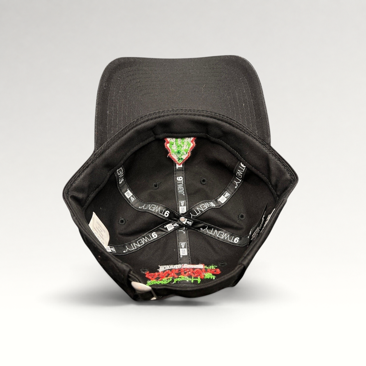 Raree Finds black New Era 9TWENTY cotton cap showing interior branding and Guardians of the Galaxy holiday embroidery