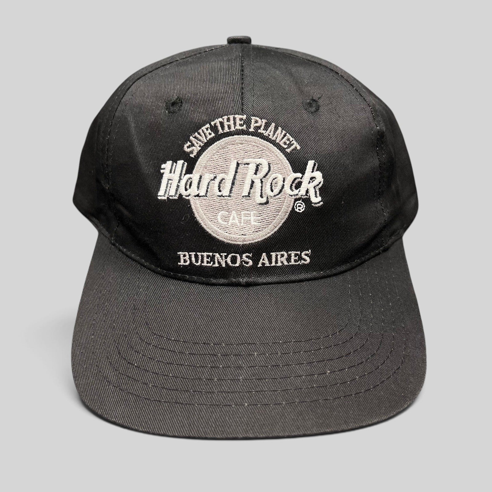 Raree Finds vintage black Hard Rock Cafe Buenos Aires snapback hat with white Save The Planet logo embroidery.
