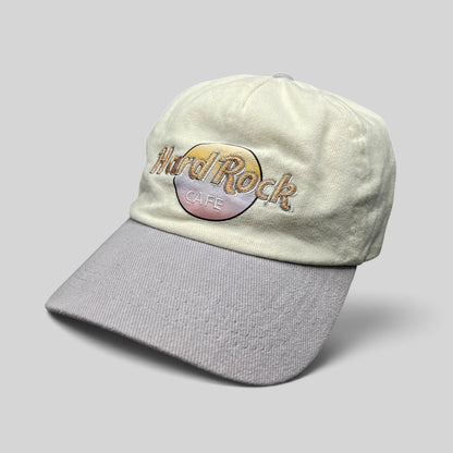 Raree Finds Hard Rock Cafe pastel logo dad hat with a cream cotton crown and light lavender brim.