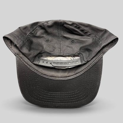 Raree Finds vintage Hard Rock Cafe black cotton snapback hat showing the adjustable plastic strap closure from behind