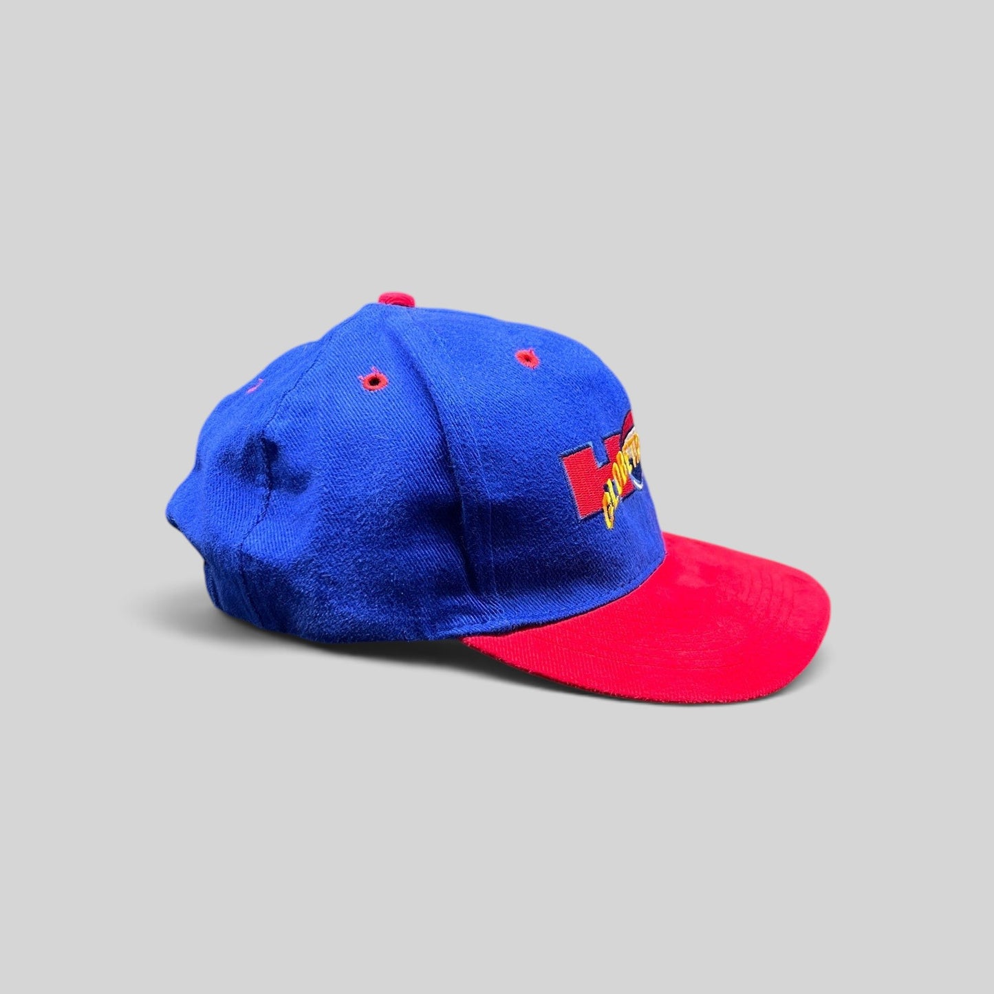Raree Finds vintage 90s Harlem Globetrotters snapback hat with a royal blue crown, red brim, and embroidered logo.