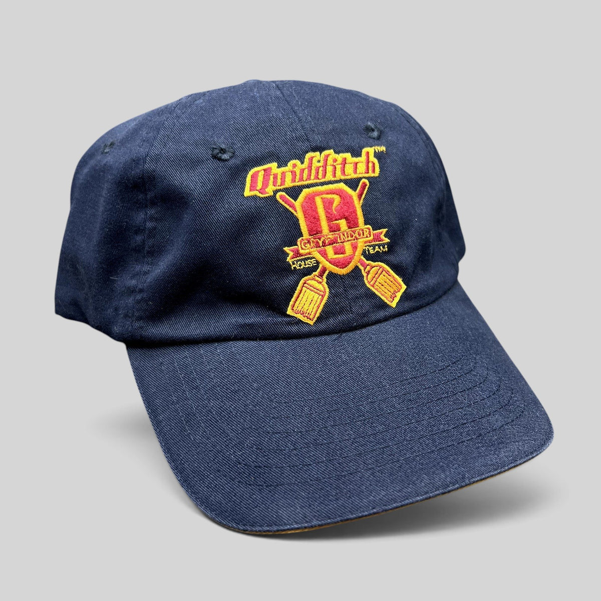 Raree Finds vintage navy blue Harry Potter Gryffindor Quidditch Team strapback hat with red and gold embroidery