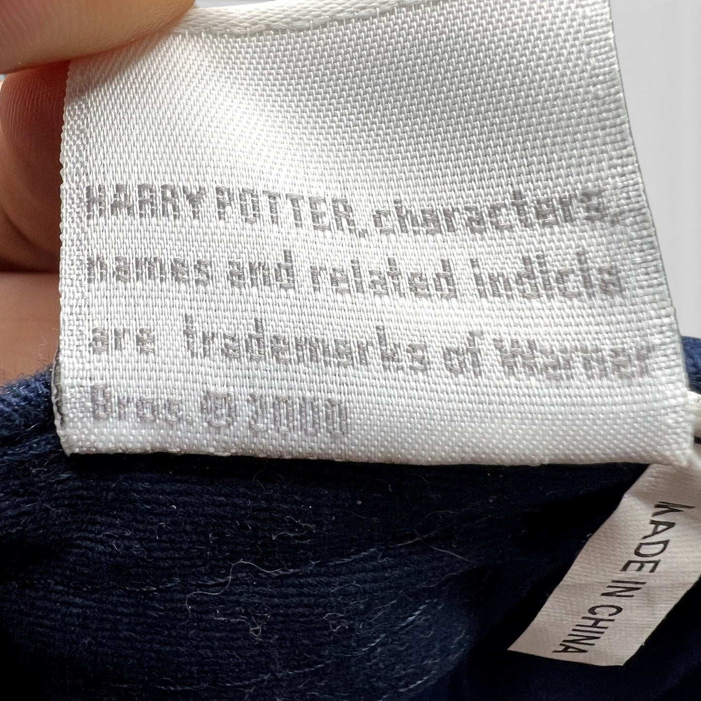 Raree Finds vintage Harry Potter 2000 Warner Bros copyright tag on navy blue fabric with Made in China label