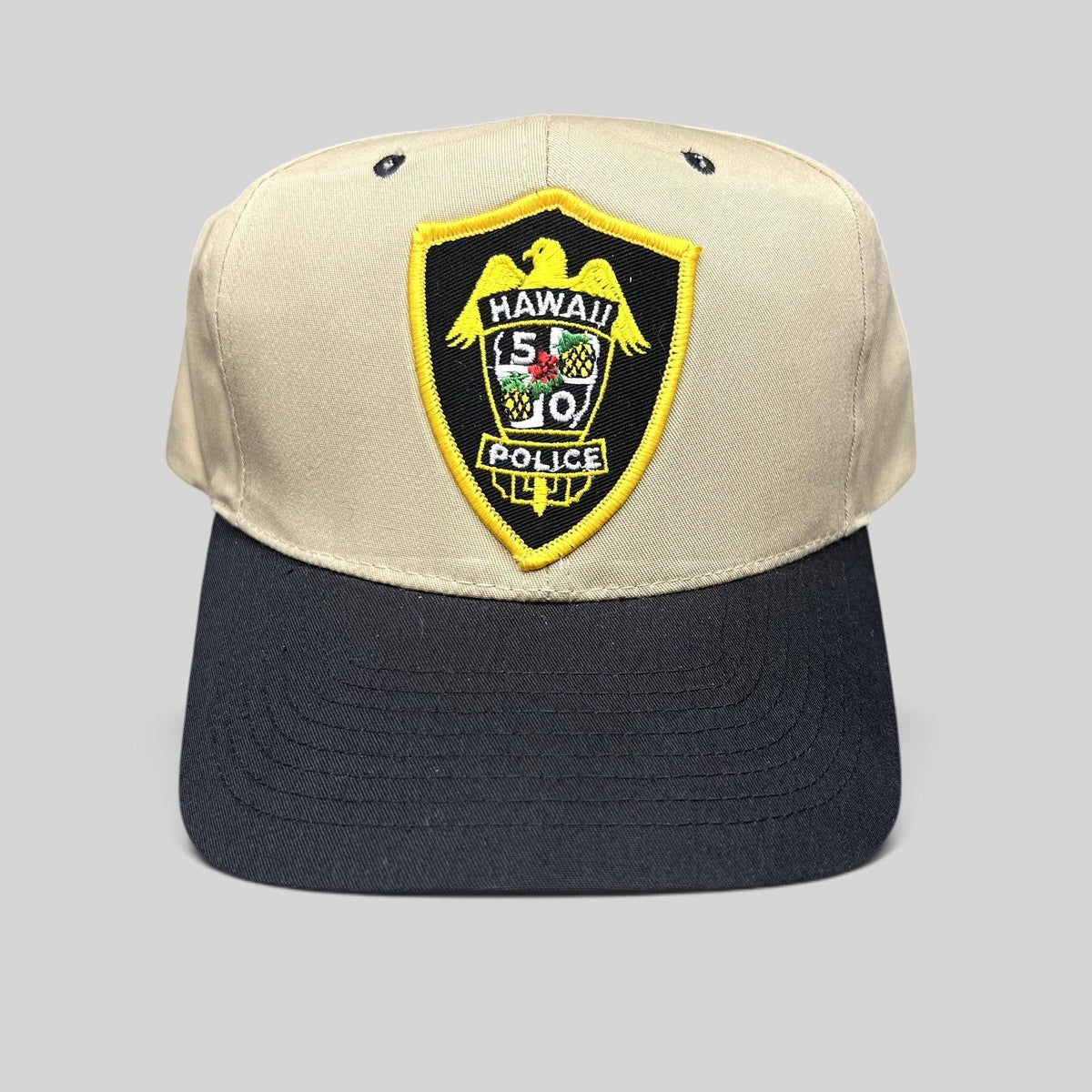 Raree Finds vintage Hawaii 5-0 Police snapback hat in khaki and black with an embroidered badge logo on the front.