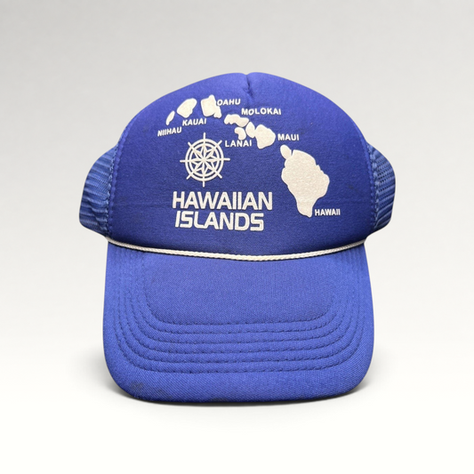 Raree Finds vintage royal blue foam trucker hat with a white Hawaiian Islands map graphic and nautical helm emblem.