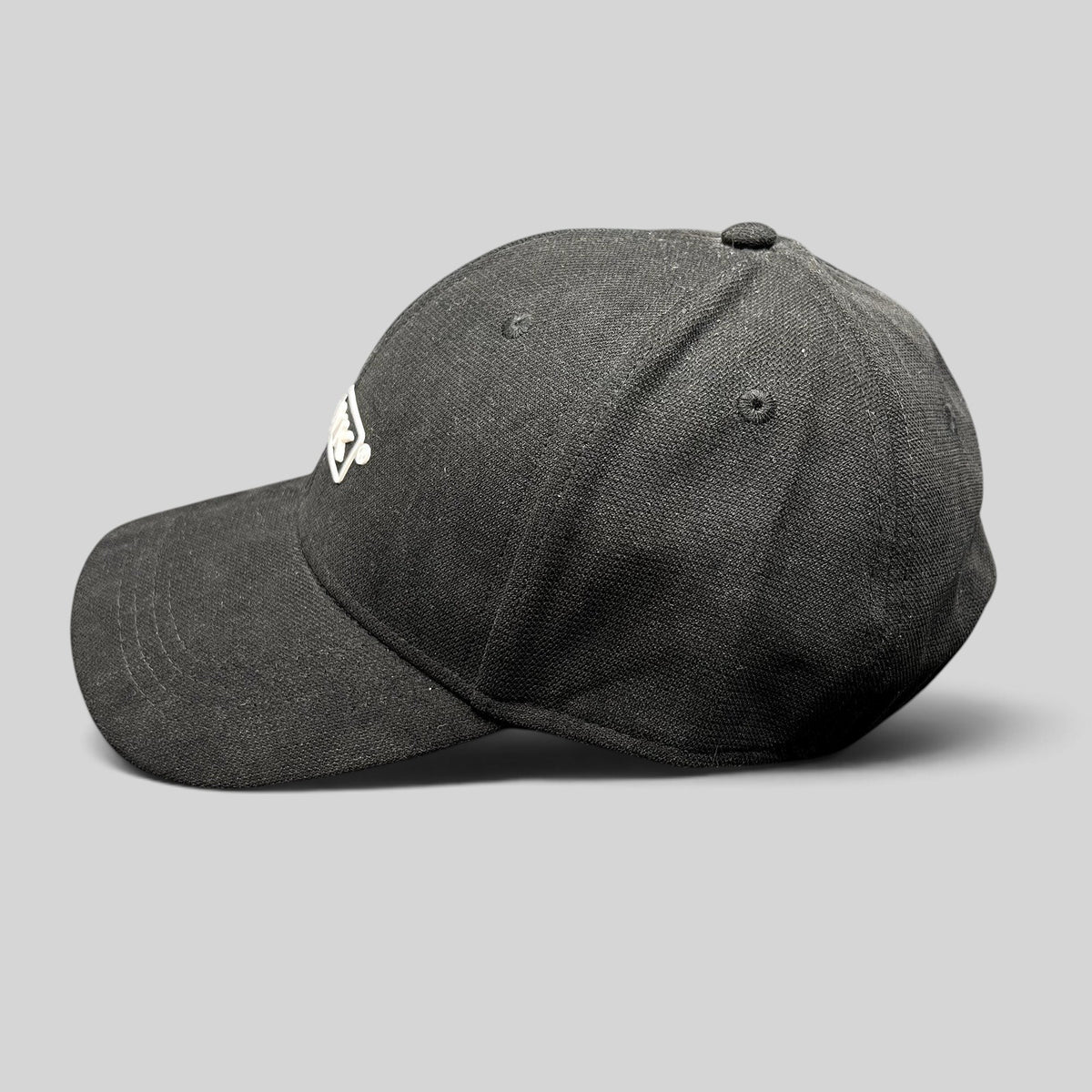 Raree Finds HAWK black polyamide strapback cap with embroidered boxed logo, side profile view