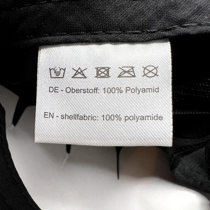 Raree Finds HAWK cap interior care label showing 100% polyamide shell fabric composition and laundry instructions