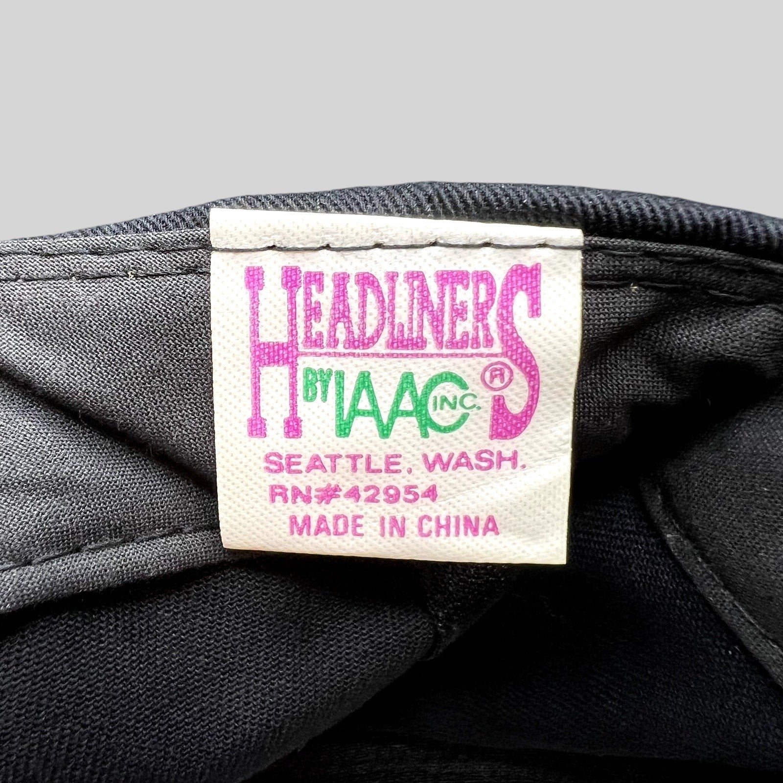 Raree Finds vintage Headliners by AAC clothing label tag inside a black 1990s Seattle souvenir snapback hat