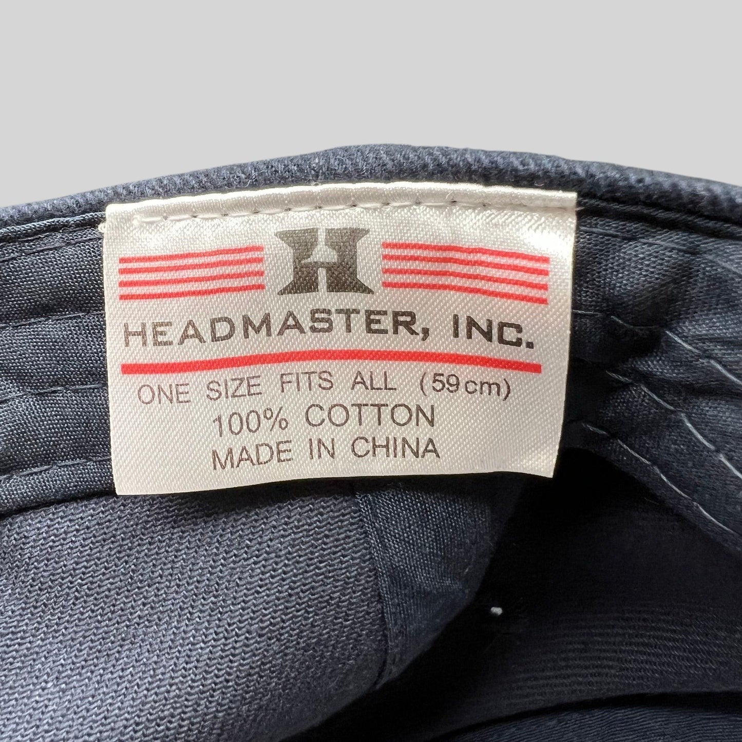 Raree Finds Headmaster Inc. cotton hat interior label showing brand logo, size, and material details