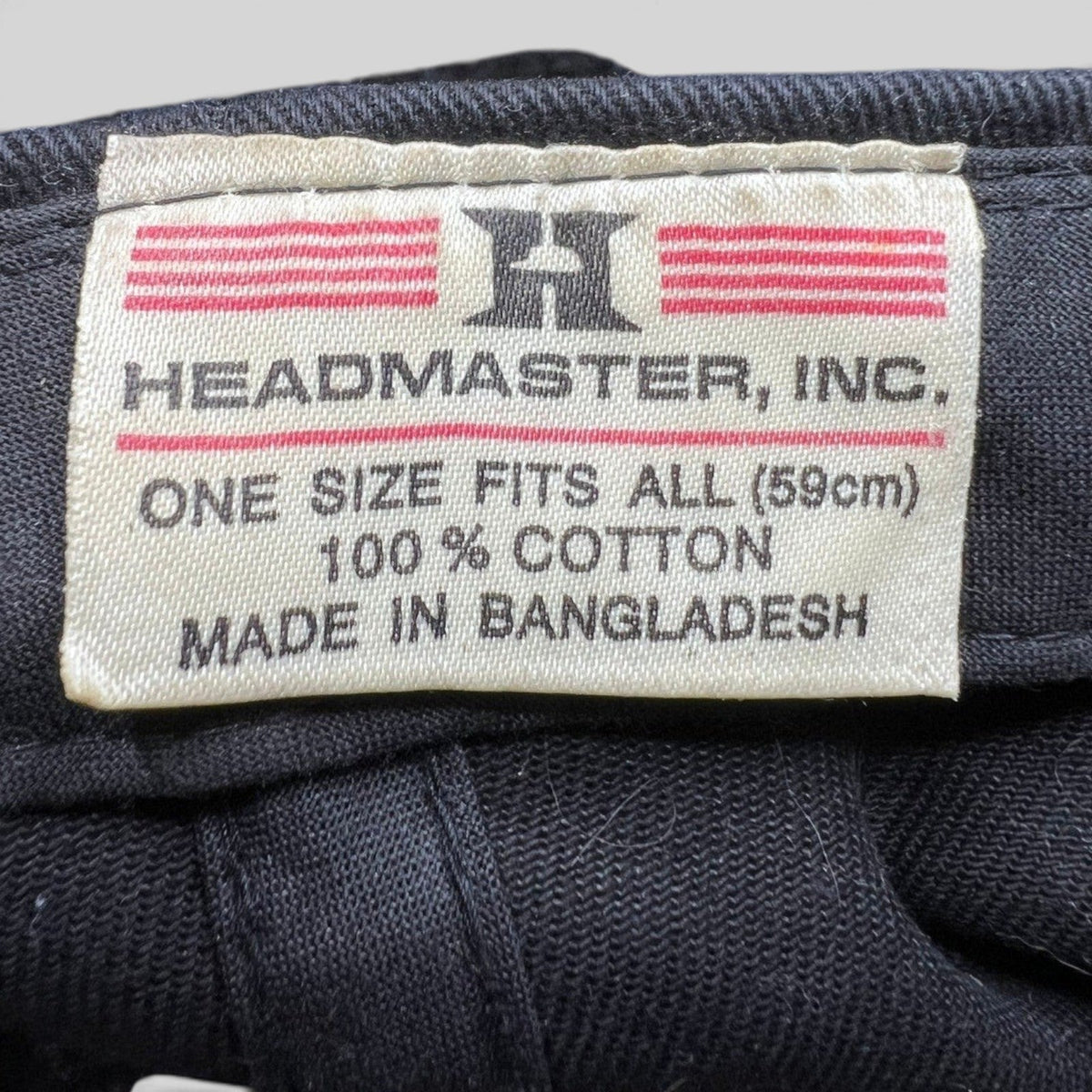 Raree Finds vintage Headmaster Inc. cotton hat interior tag showing 100 percent cotton and one size fits all details.