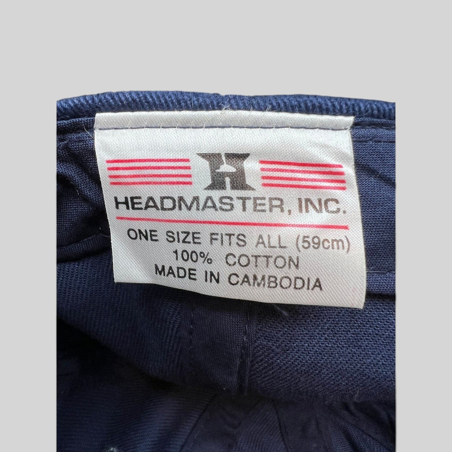 Raree Finds vintage Headmaster Inc cotton hat interior label showing brand logo, size, and material details.