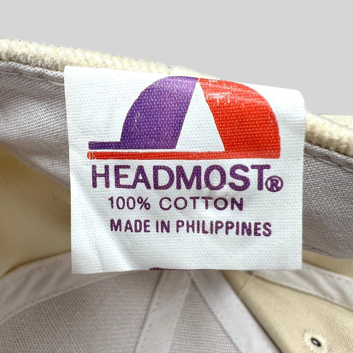 Raree Finds vintage Headmost hat interior tag showing 100% cotton material and Made in Philippines origin