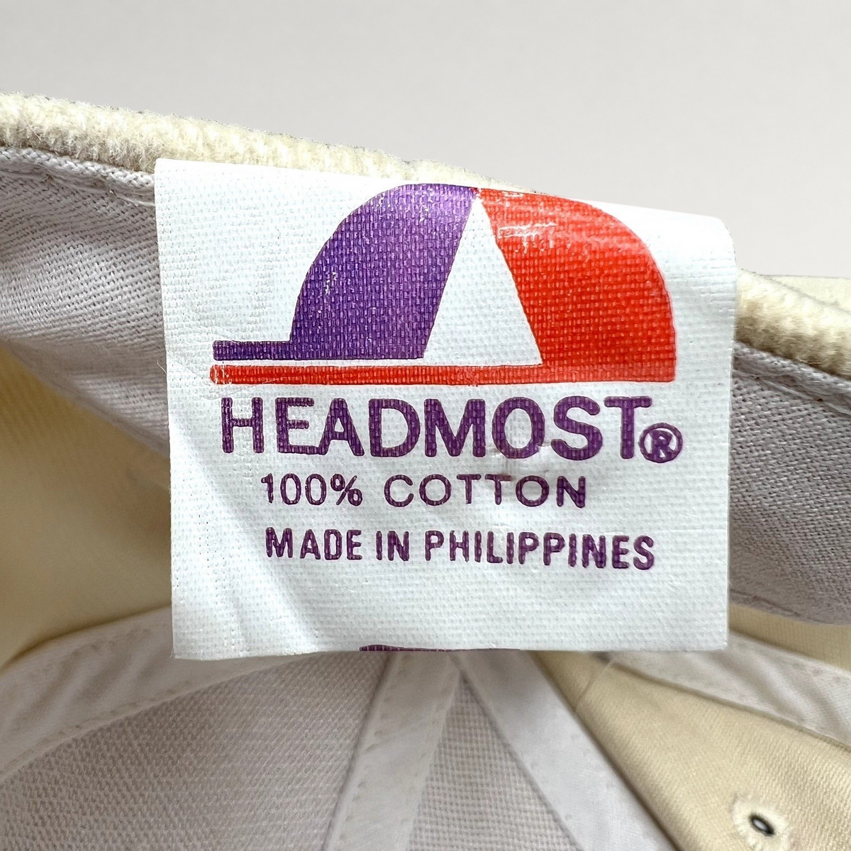 Raree Finds vintage Headmost hat interior tag showing 100% cotton material and Made in Philippines origin