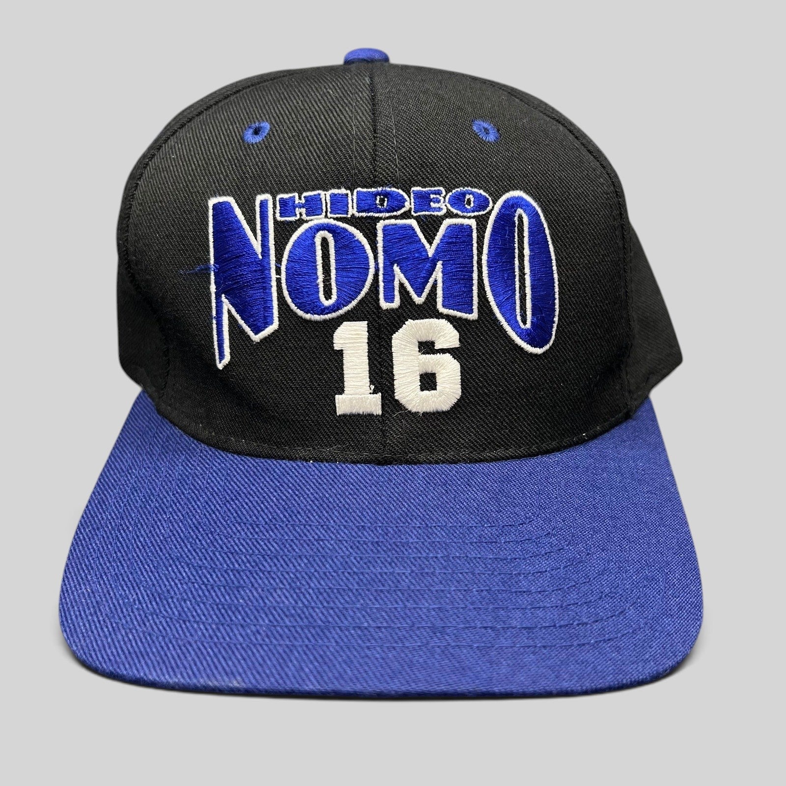 Raree Finds vintage 90s Los Angeles Dodgers Hideo Nomo snapback hat with black crown and blue brim embroidery