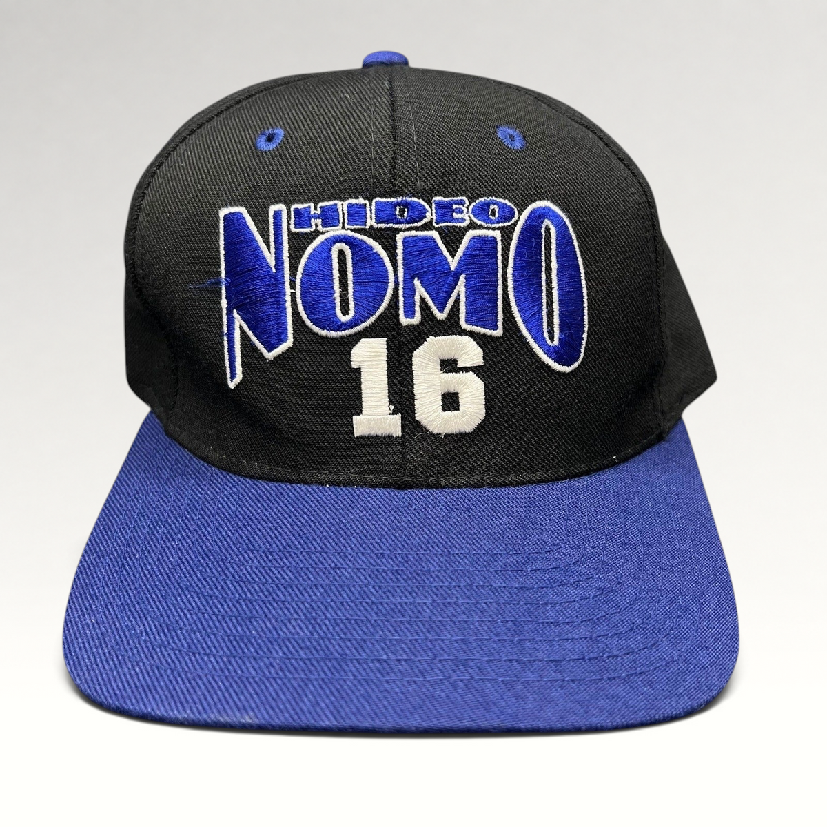 Raree Finds vintage 90s Los Angeles Dodgers Hideo Nomo snapback hat with black crown and blue brim embroidery