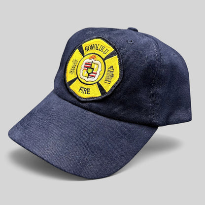Raree Finds vintage navy blue cotton strapback hat with an embroidered Honolulu Fire Department maltese cross patch.