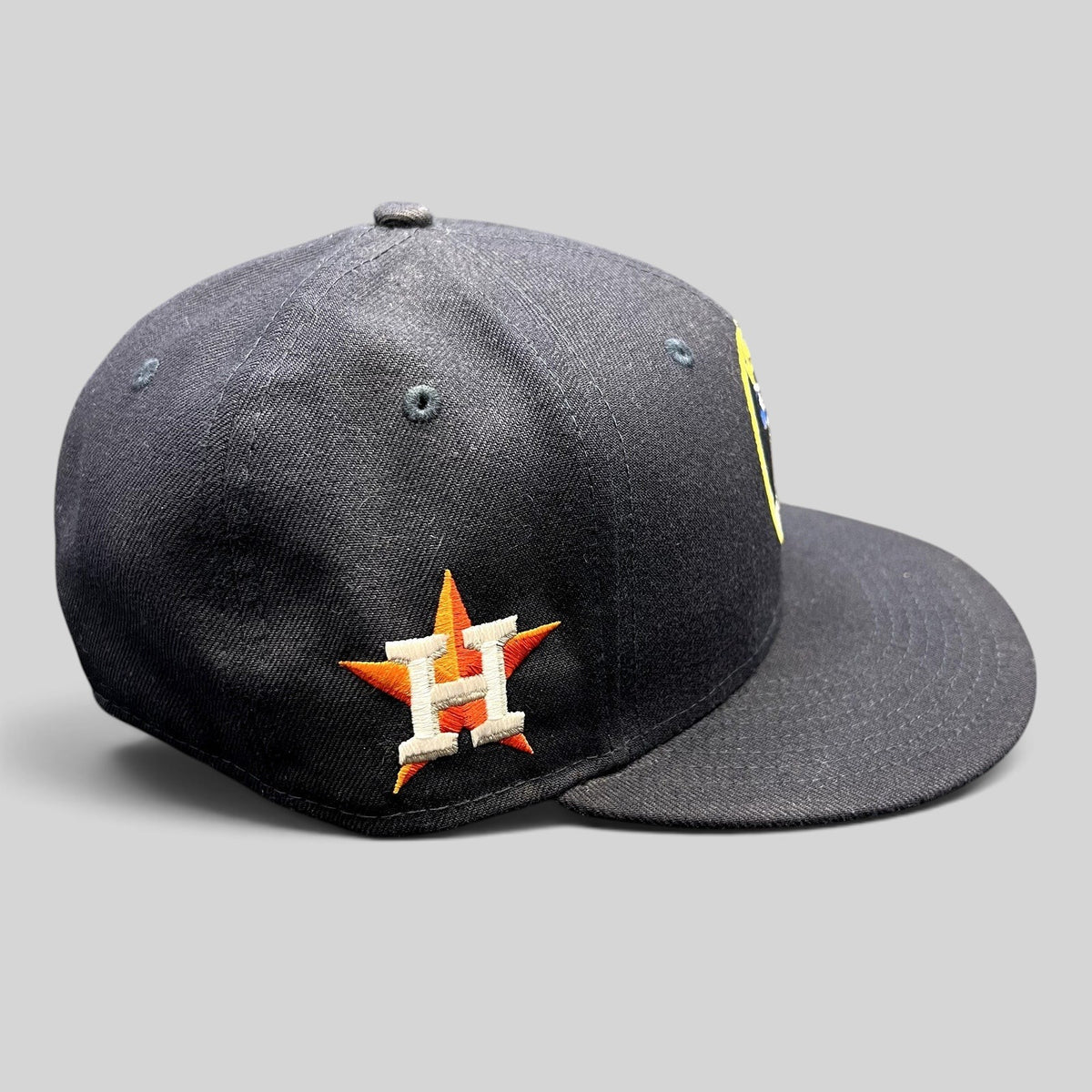 Raree Finds navy blue New Era 59FIFTY fitted hat featuring an embroidered Houston Astros star logo on the side