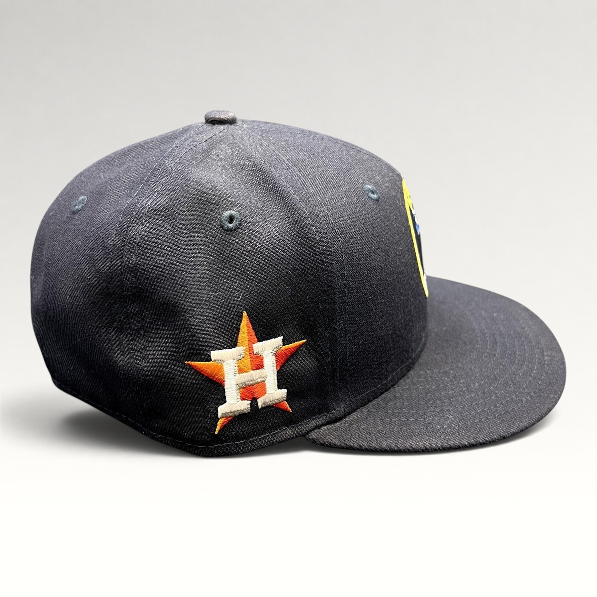 Raree Finds navy blue New Era 59FIFTY fitted hat featuring an embroidered Houston Astros star logo on the side