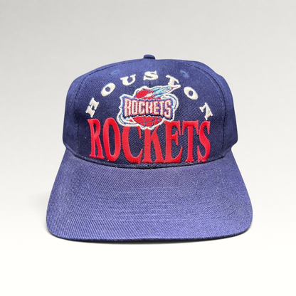 Raree Finds vintage 1990s Houston Rockets snapback hat in navy blue with red embroidered logo and green undervisor