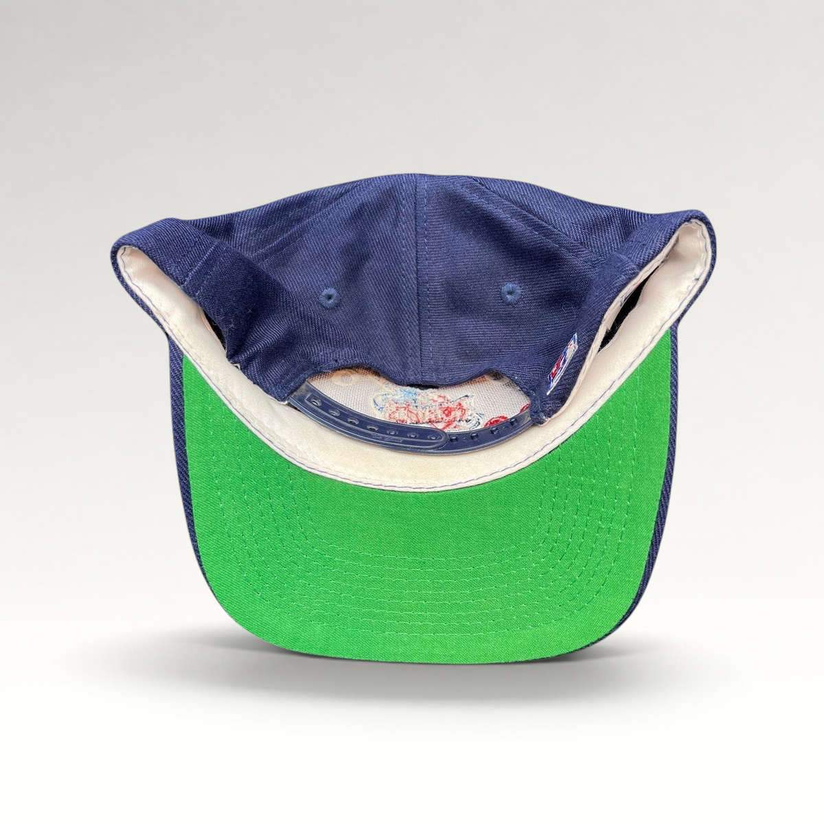 Raree Finds vintage 1990s Houston Rockets snapback hat by The Game featuring a navy crown and green undervisor