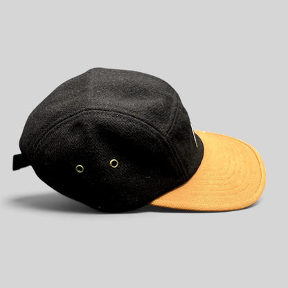 Raree Finds HUF black wool-style camp hat with a contrasting tan brim and side ventilation eyelets